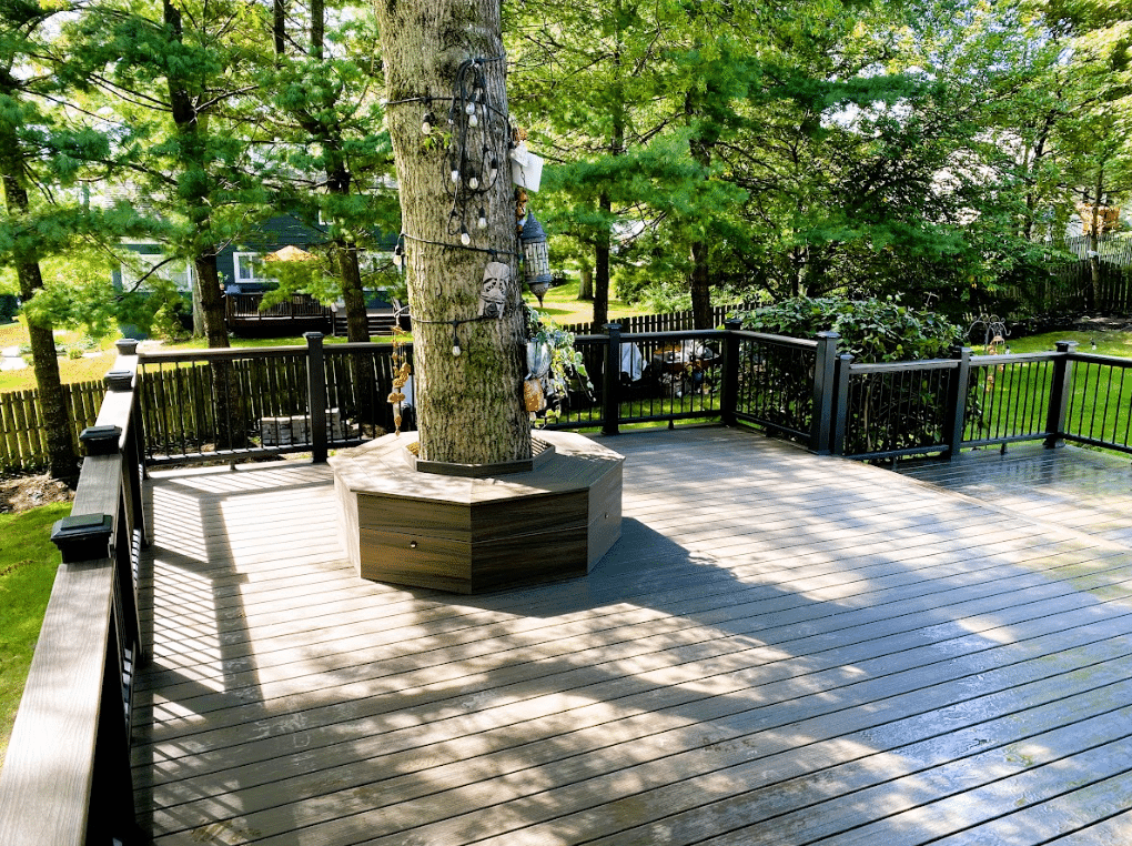 multi-level composite deck with white and brown railing