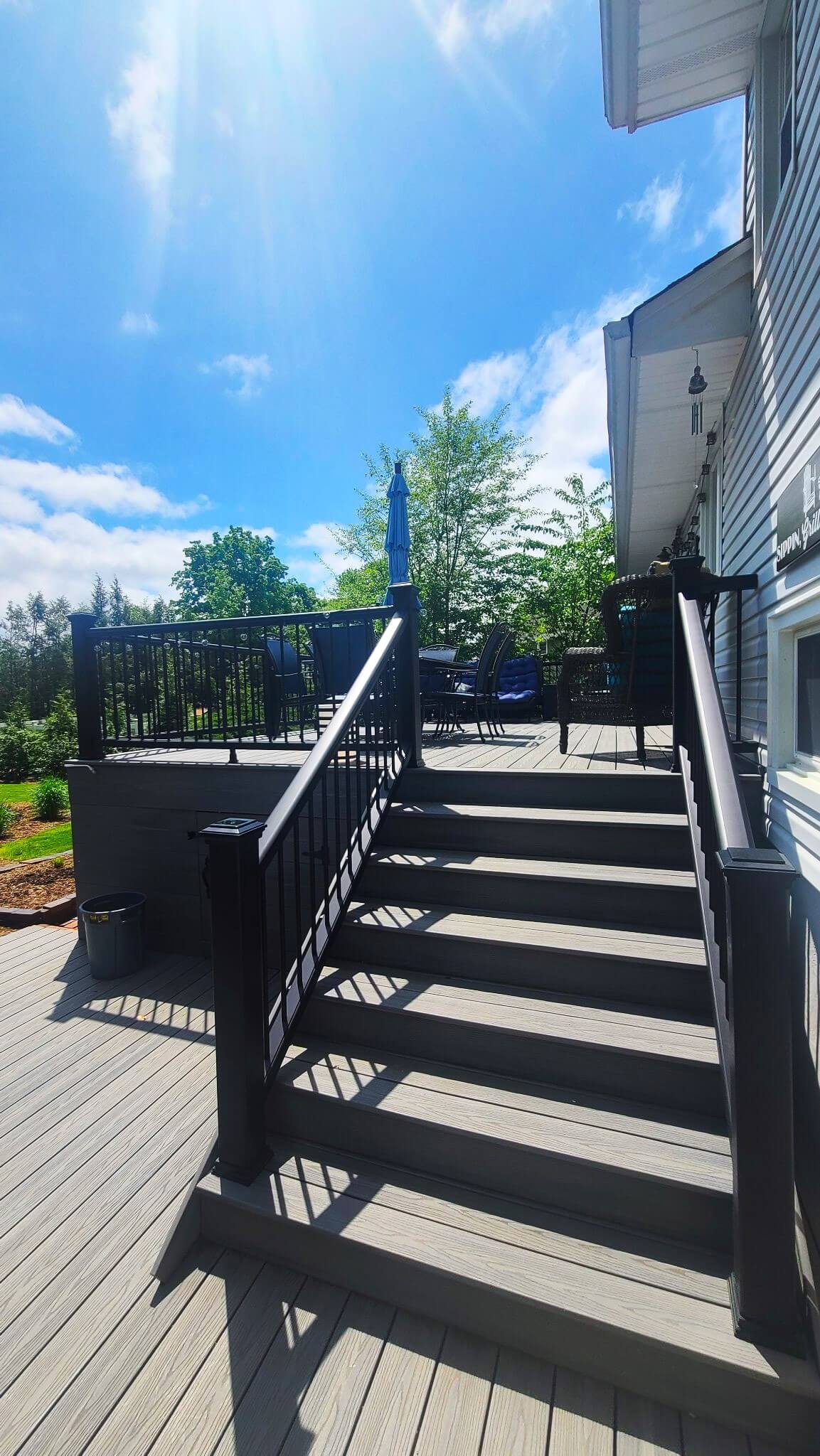 photo of new raised deck with deck railing and steps