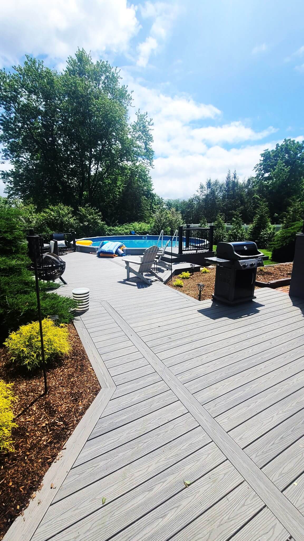 photo of patio deck leading to pool deck and pool