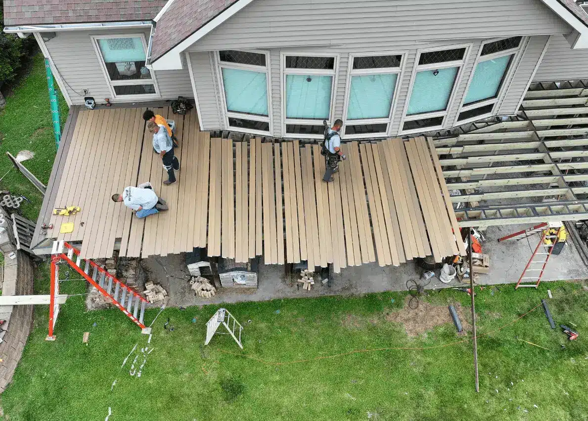 photo of a Decks By Murray crew working on an elevated deck with underneath decking area