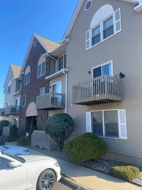 Wooden balcony decks on apartment building that will be replaced.