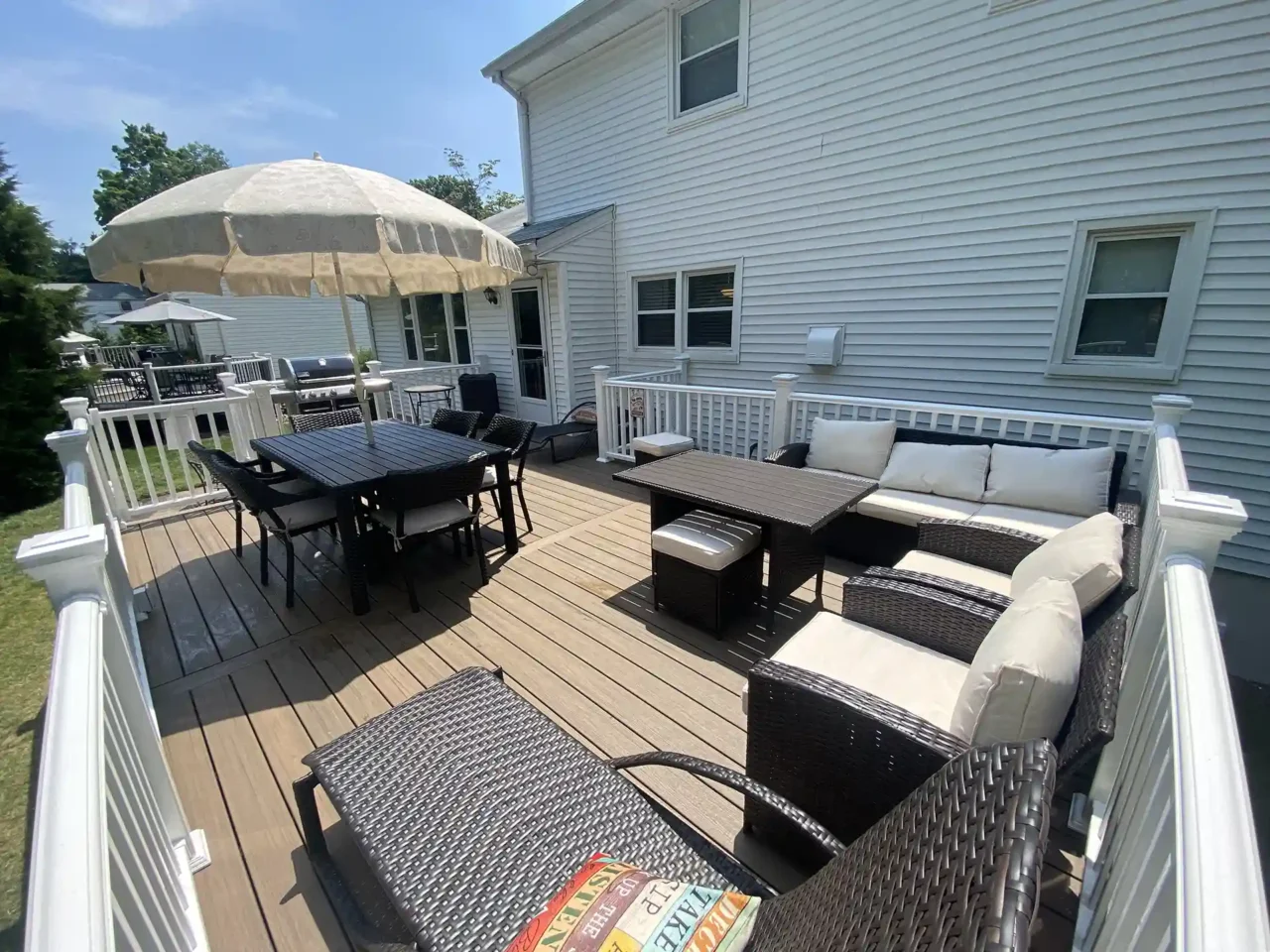 photo of a composite deck with outdoor furniture - Deck Remodeling and Resurfacing in New Jersey